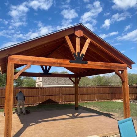 Cedar wood patio cover with exposed beams in an Austin backyard